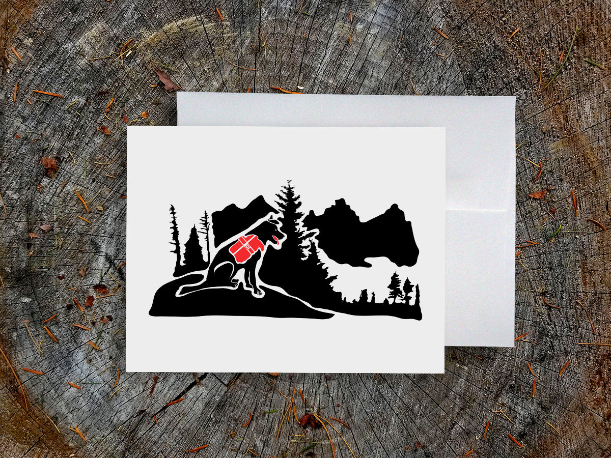 Greeting card with black dog with red backpack in the mountains.