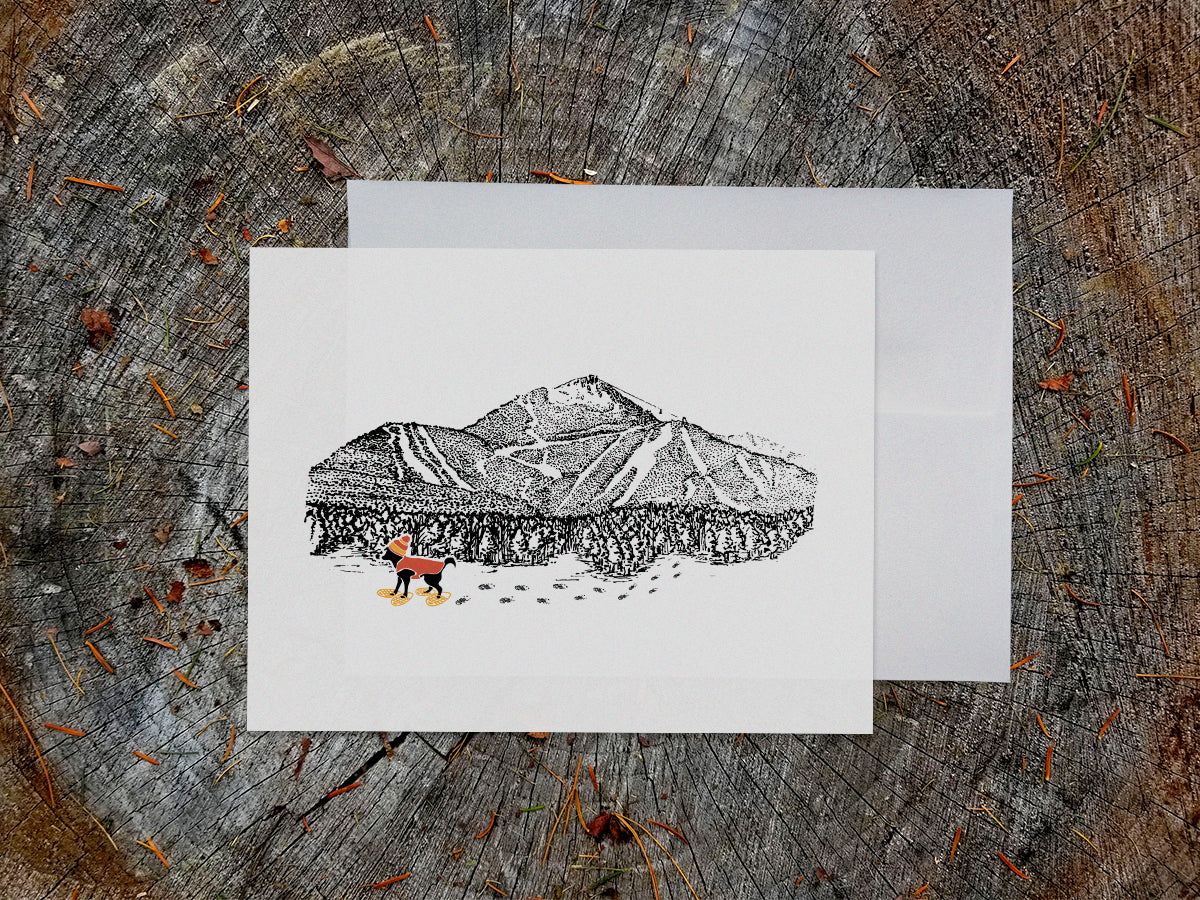 Greeting card with image of a mountain with ski trails and dog snowshoeing.
