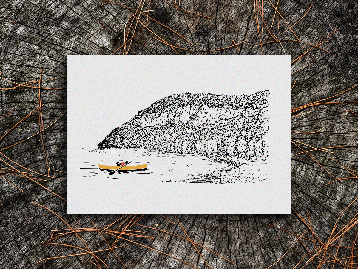 Art print of a dog paddling a yellow canoe with a mountain in the background