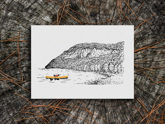 Art print of a dog paddling a yellow canoe with a mountain in the background