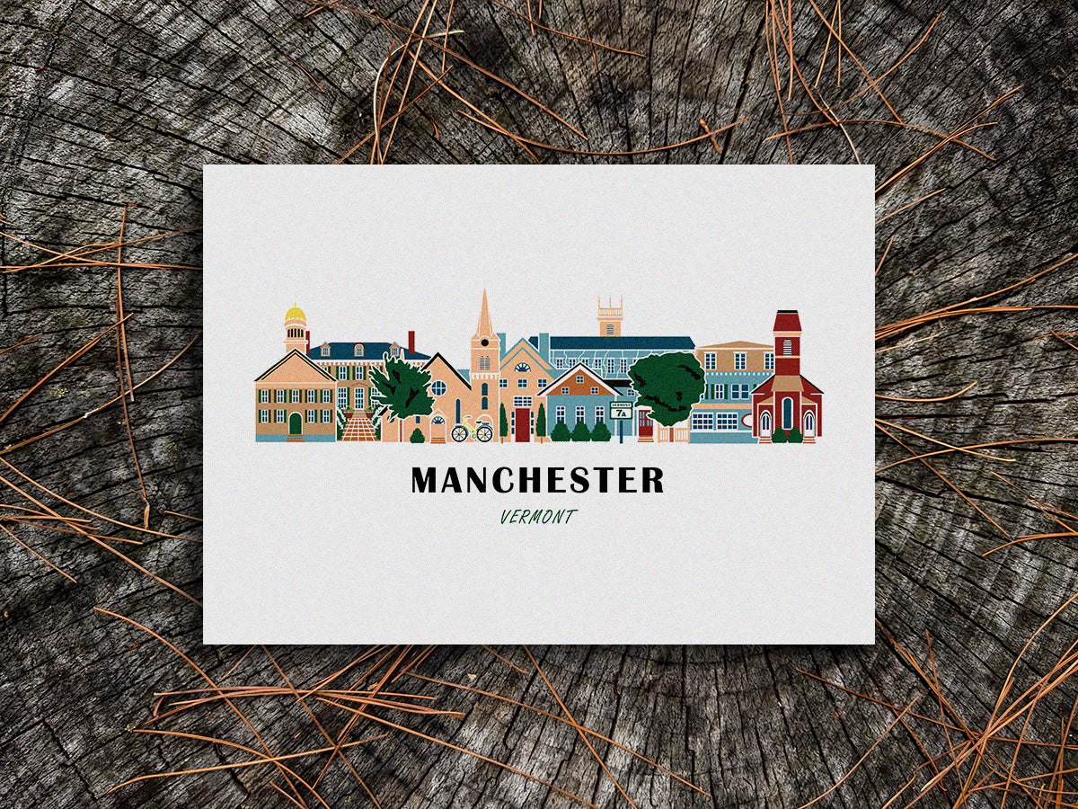 Art print of buildings arranged in a skyline with the text Manchester Vermont