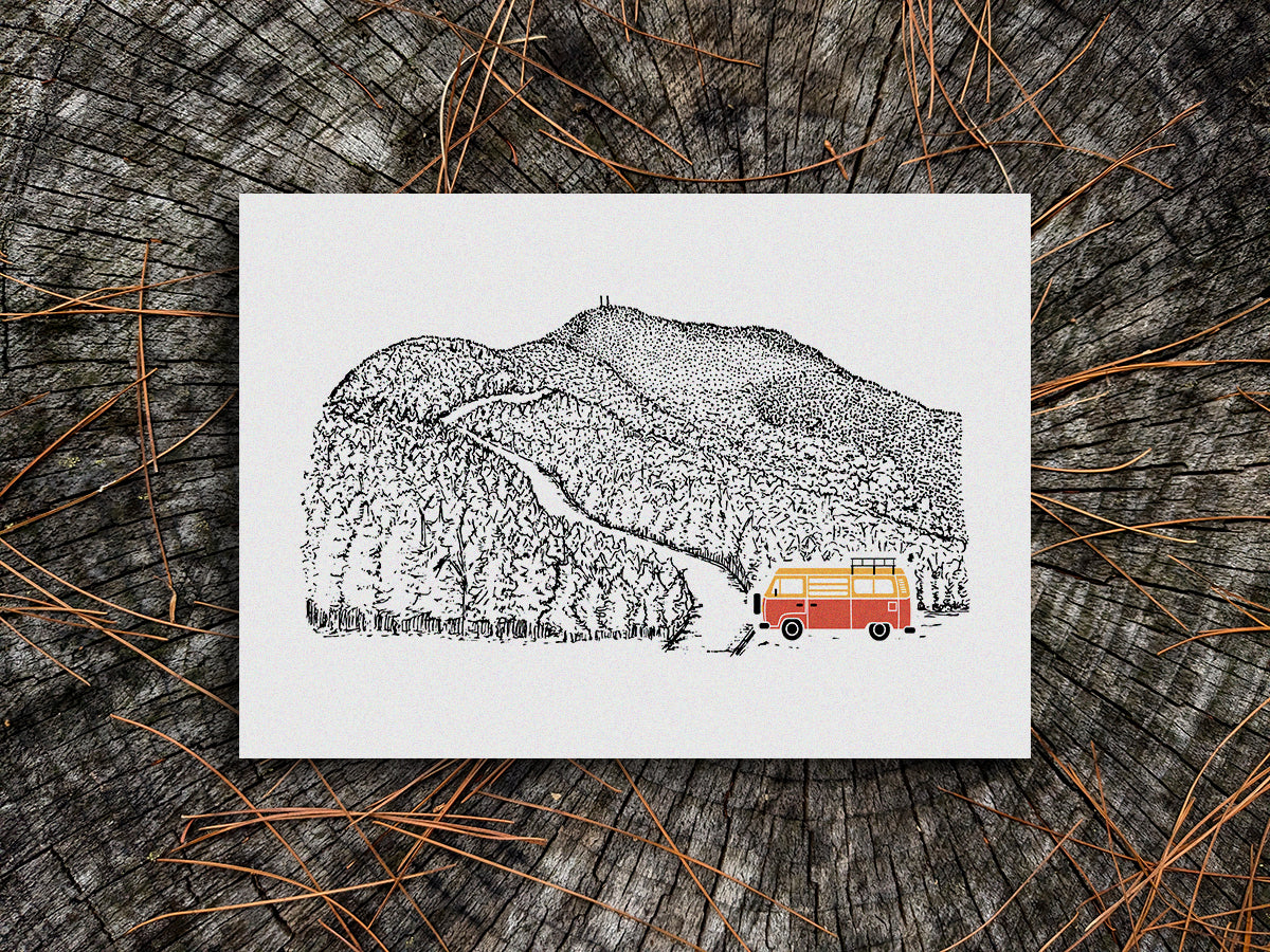 Art print of red and yellow van at the bottom of a mountain road.