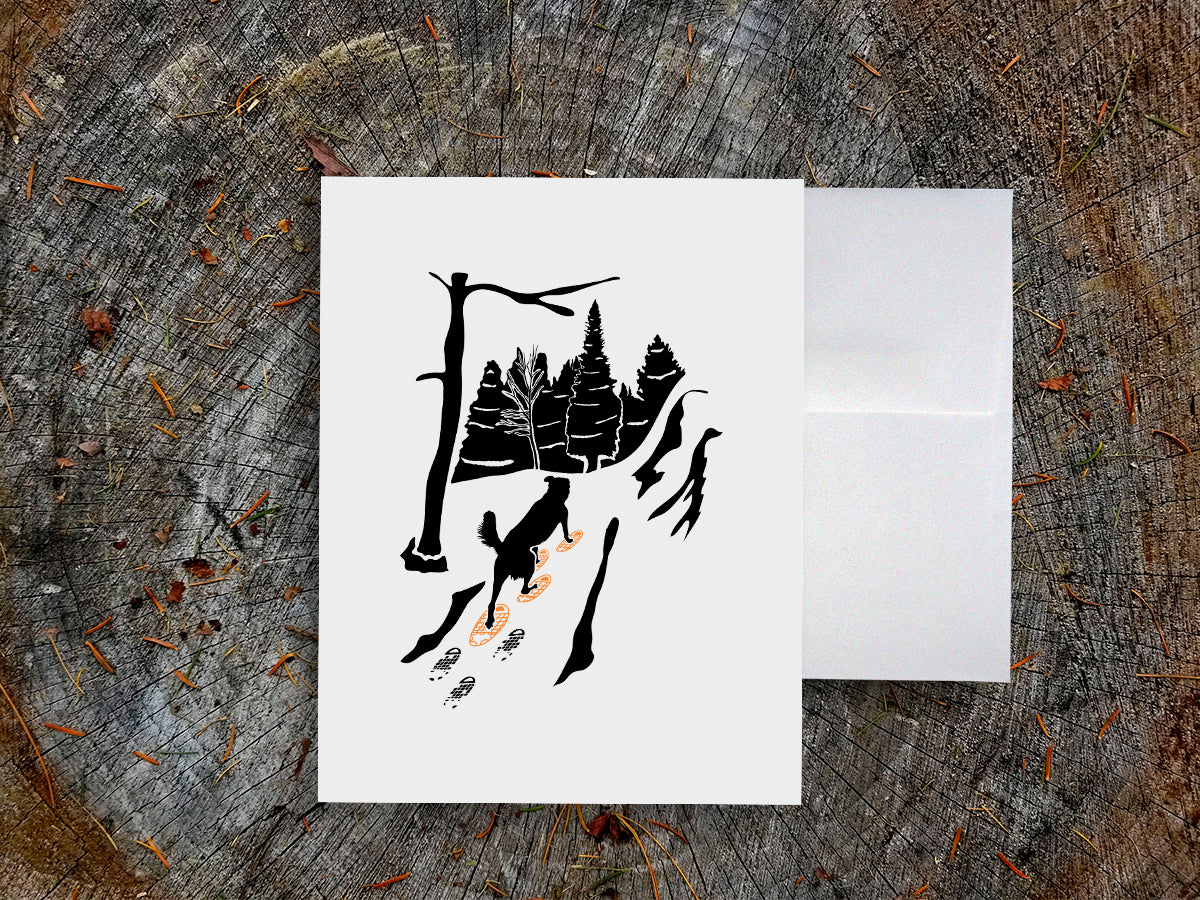 Greeting card with image of dog walking through forest wearing yellow snowshoes.