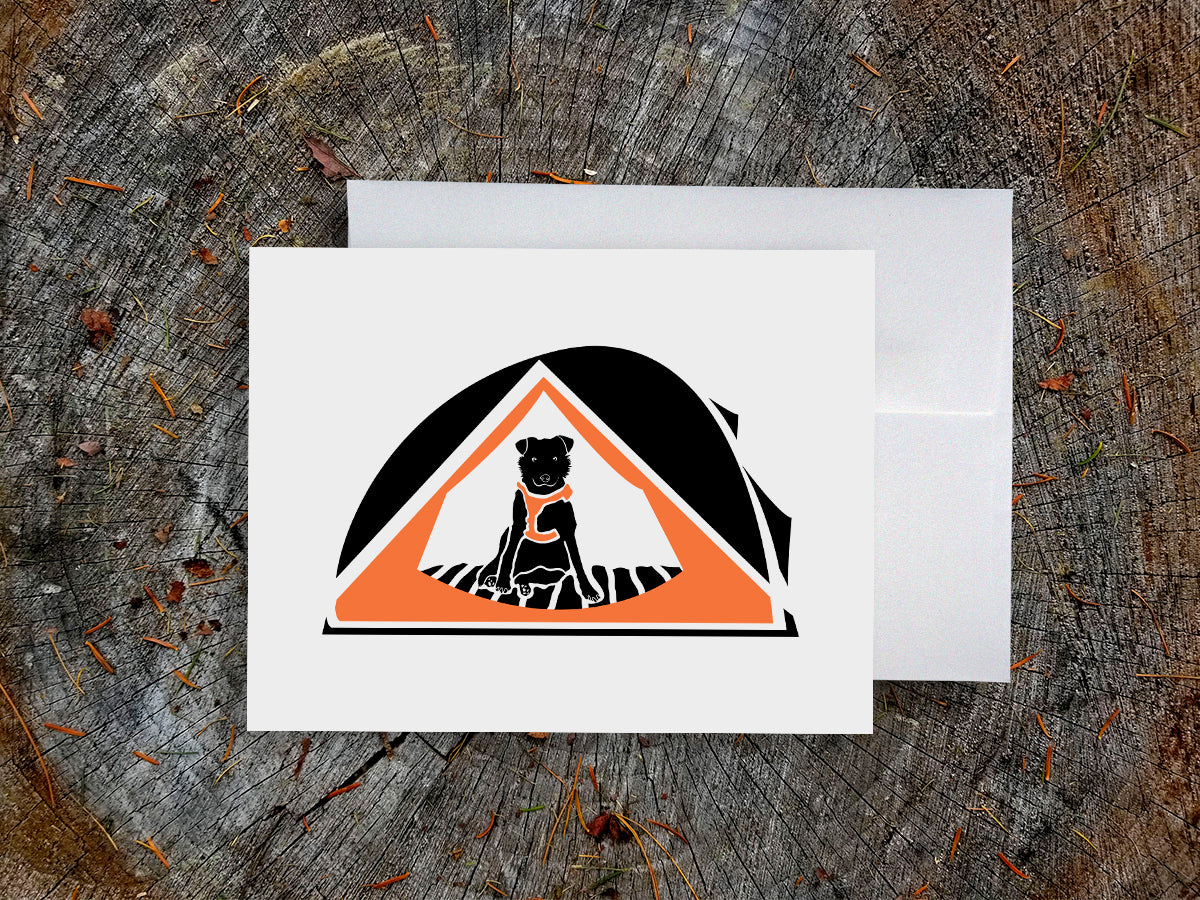 Greeting card with black dog with orange harness sitting in an orange camping tent.