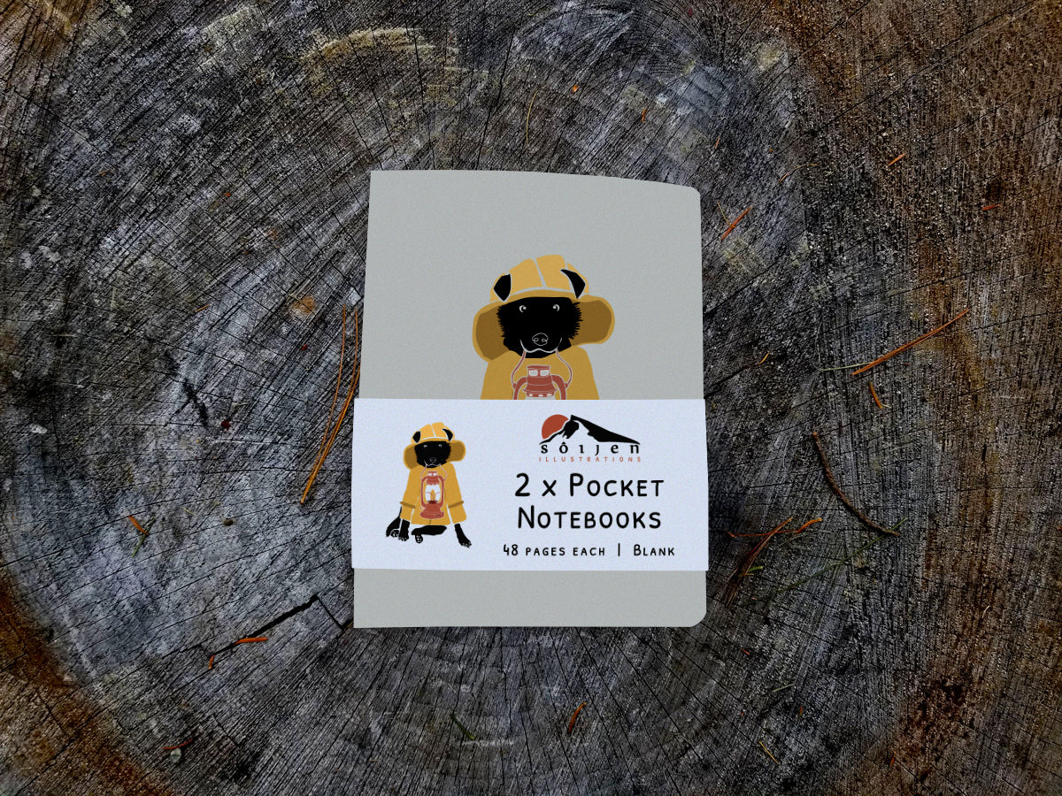 Notebook with illustration of a dog in fisherman yellow jacket with lamp