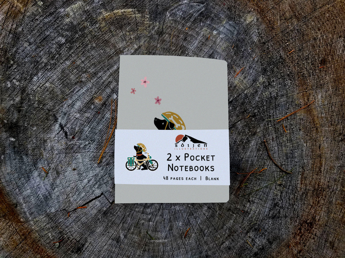 Notebook with illustration of a dog with helmet and bike