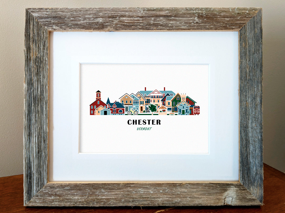 Framed art print of buildings arranged in a skyline with the text Chester Vermont