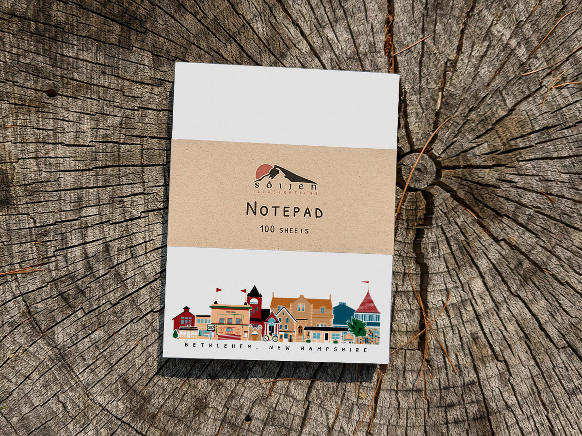 Notepad with Bethlehem New Hampshire cityscape on a wood background
