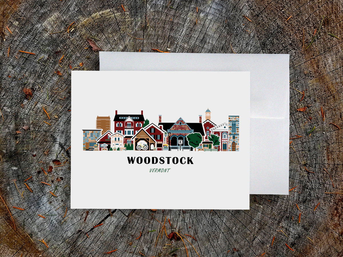 Greeting card with Woodstock, Vermont illustration on a wooden surface