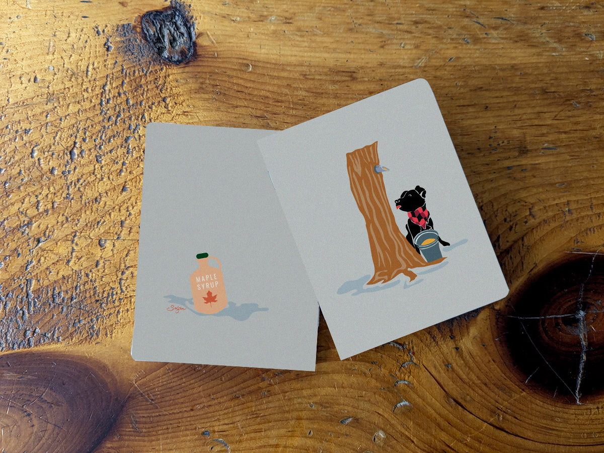 Notebook with illustration of a dog at maple syrup tap.