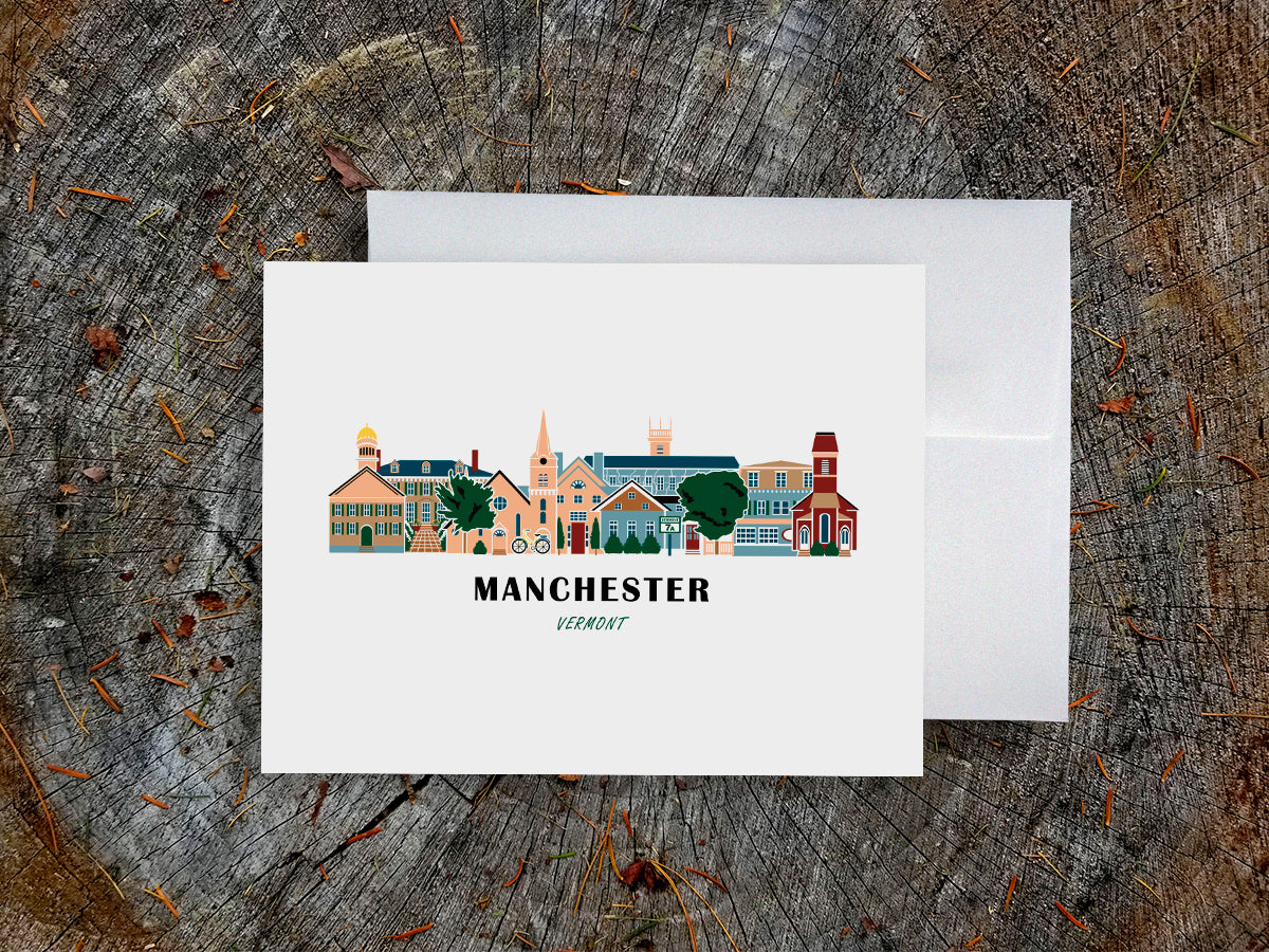 Greeting card with image of buildings arranged in a city skyline with the text Manchester Vermont