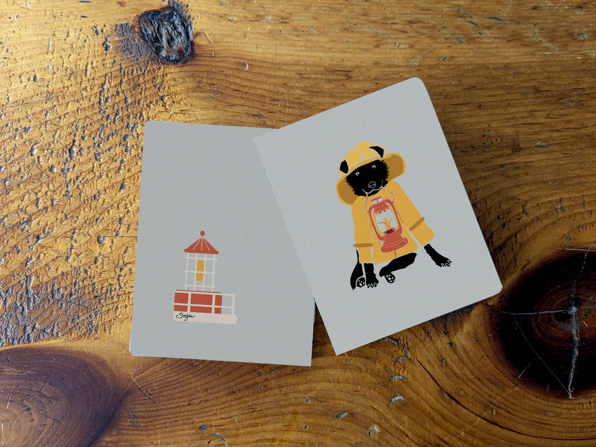 Notebook with illustration of a dog in fisherman yellow jacket with lamp