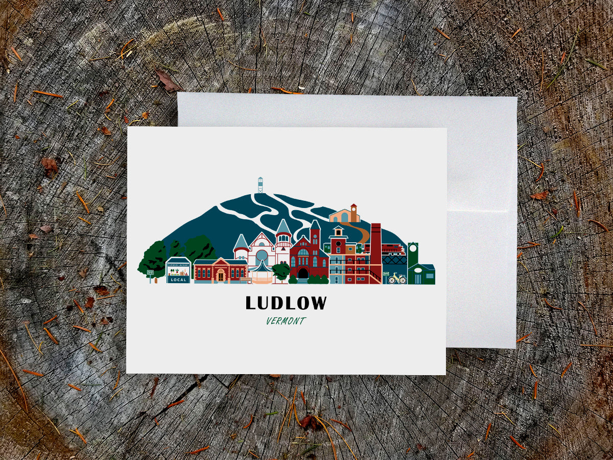 Greeting card with image of buildings arranged in a city skyline with the text Ludlow Vermont