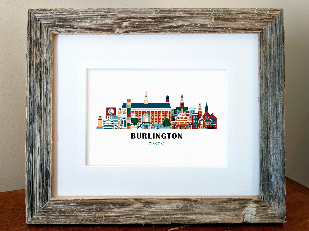 Framed art print of buildings arranged in a skyline with the text Burlington Vermont
