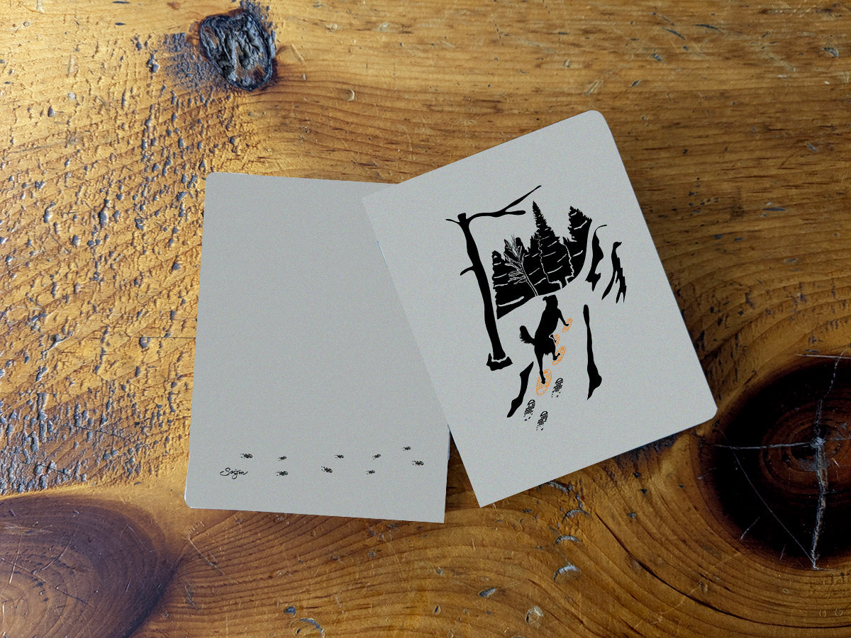 Notebook with illustration of a dog snowshoeing
