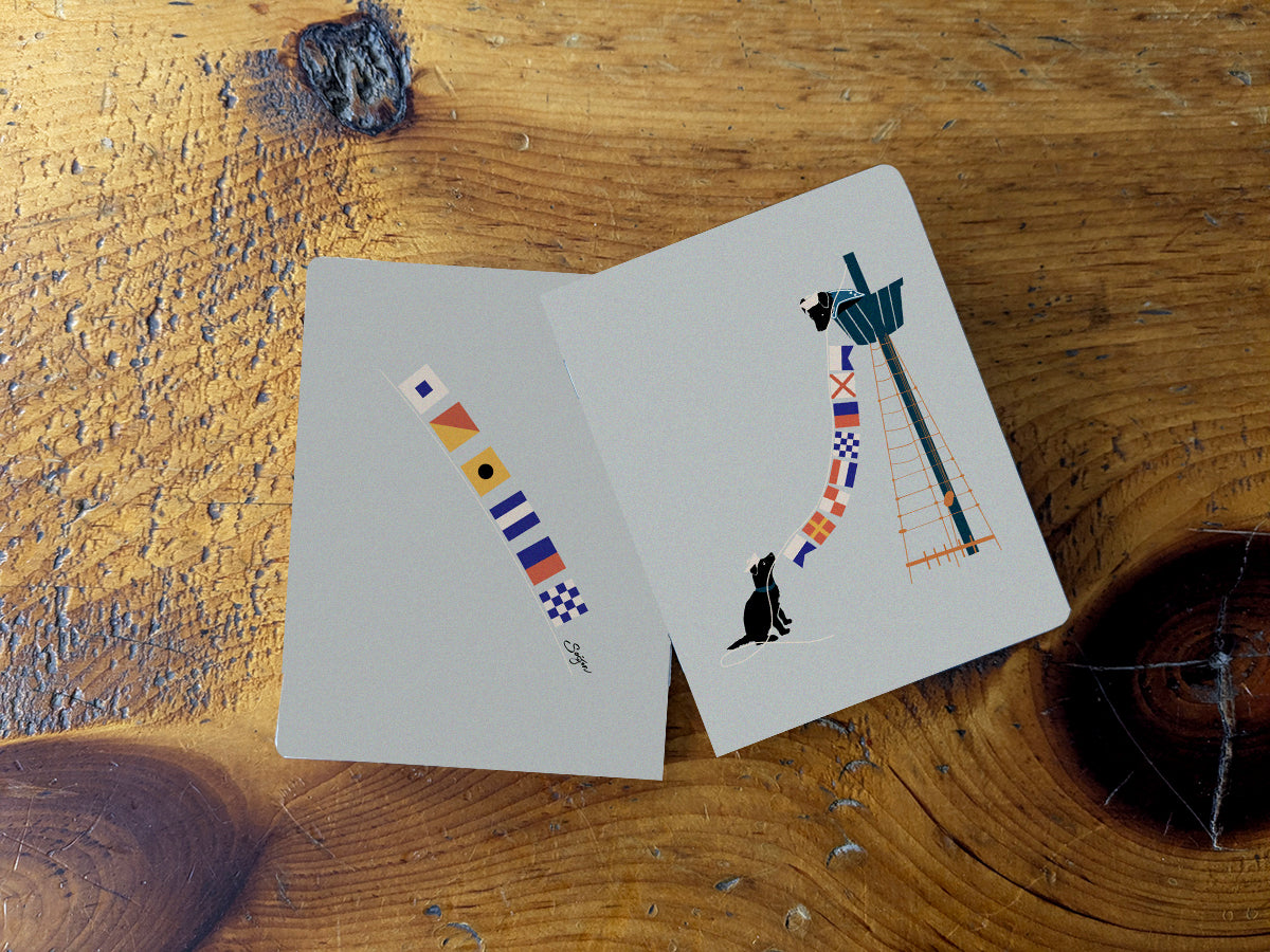 Notebook with illustration of a dogs hanging nautical flags