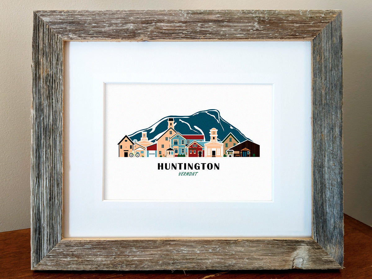 Framed art print of buildings arranged in a skyline with the text Huntington Vermont