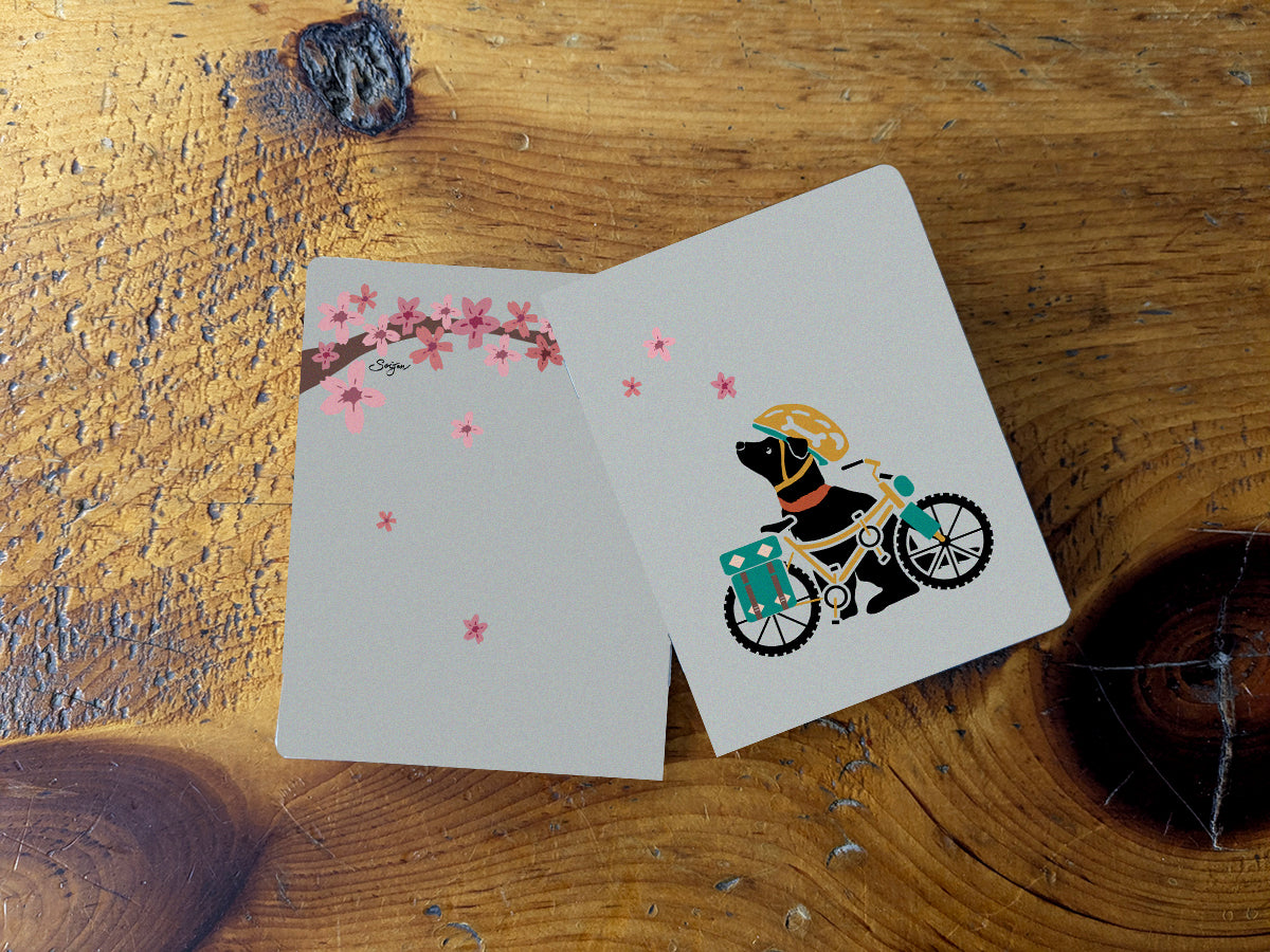 Notebook with illustration of a dog with helmet and bike