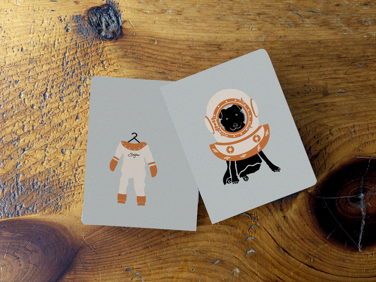 Notebook with illustration of a dog with scuba diving helmet.