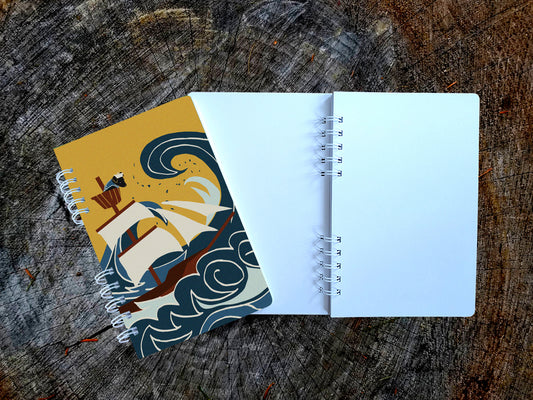 Notebook with illustration of ship sailing through large waves with dog onboard.