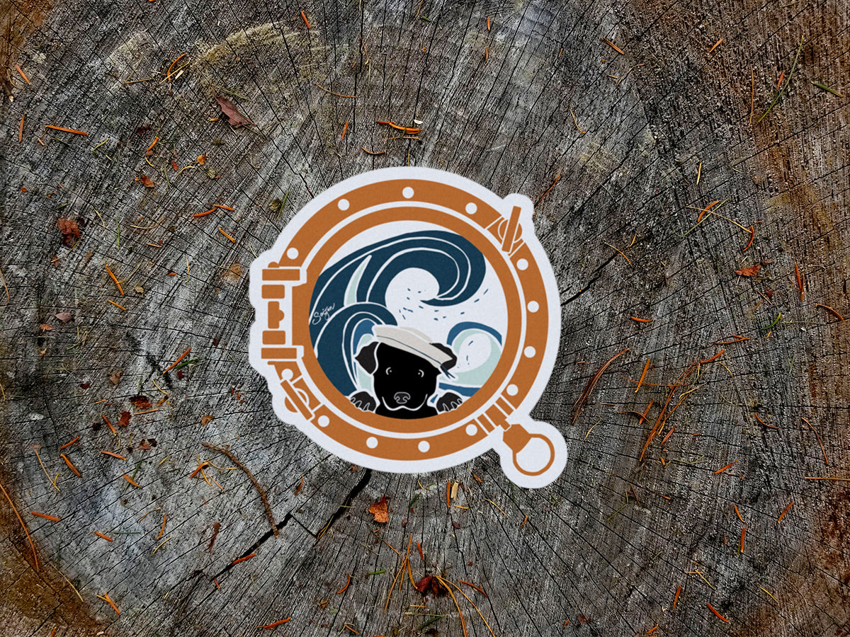 Sticker with a design of a dog and waves looking through a porthole on a wooden background