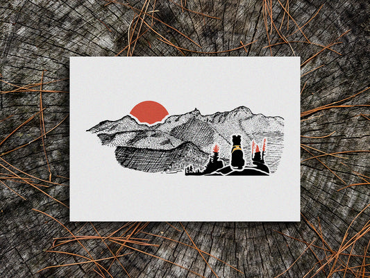 Art print of black dog looking at a mountains with red sunset