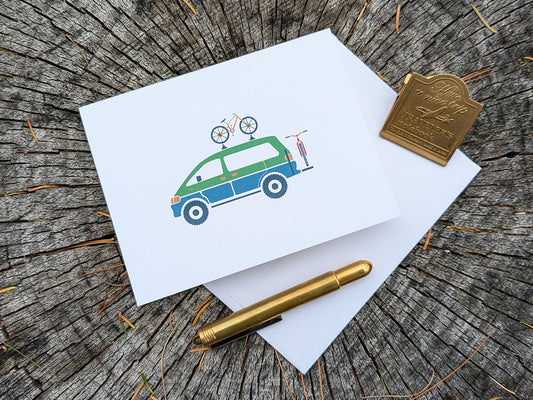 Greeting card with image of a colorful van with 2 bikes.