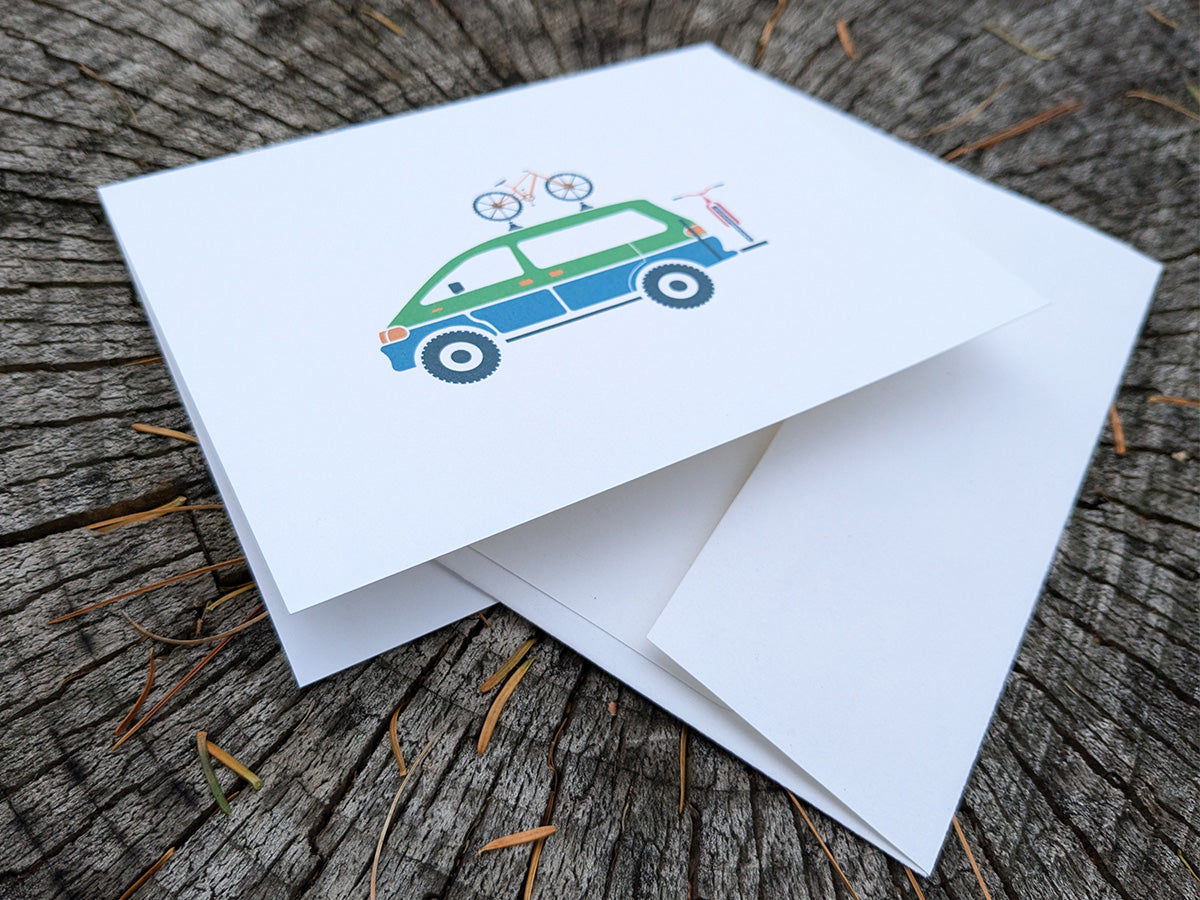 Greeting card with image of a colorful van with 2 bikes.