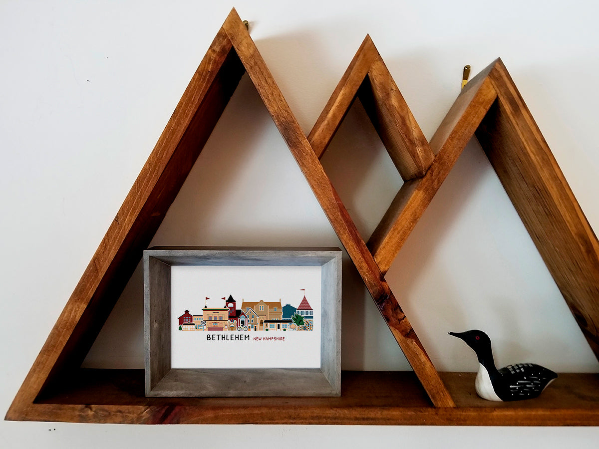 Framed illustration of Bethlehem, New Hampshire on a wooden shelf