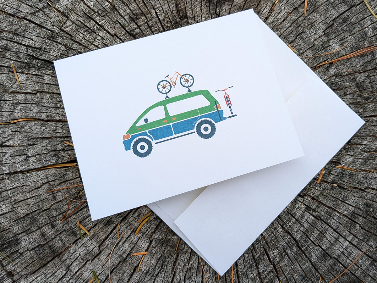 Greeting card with image of a colorful van with 2 bikes.