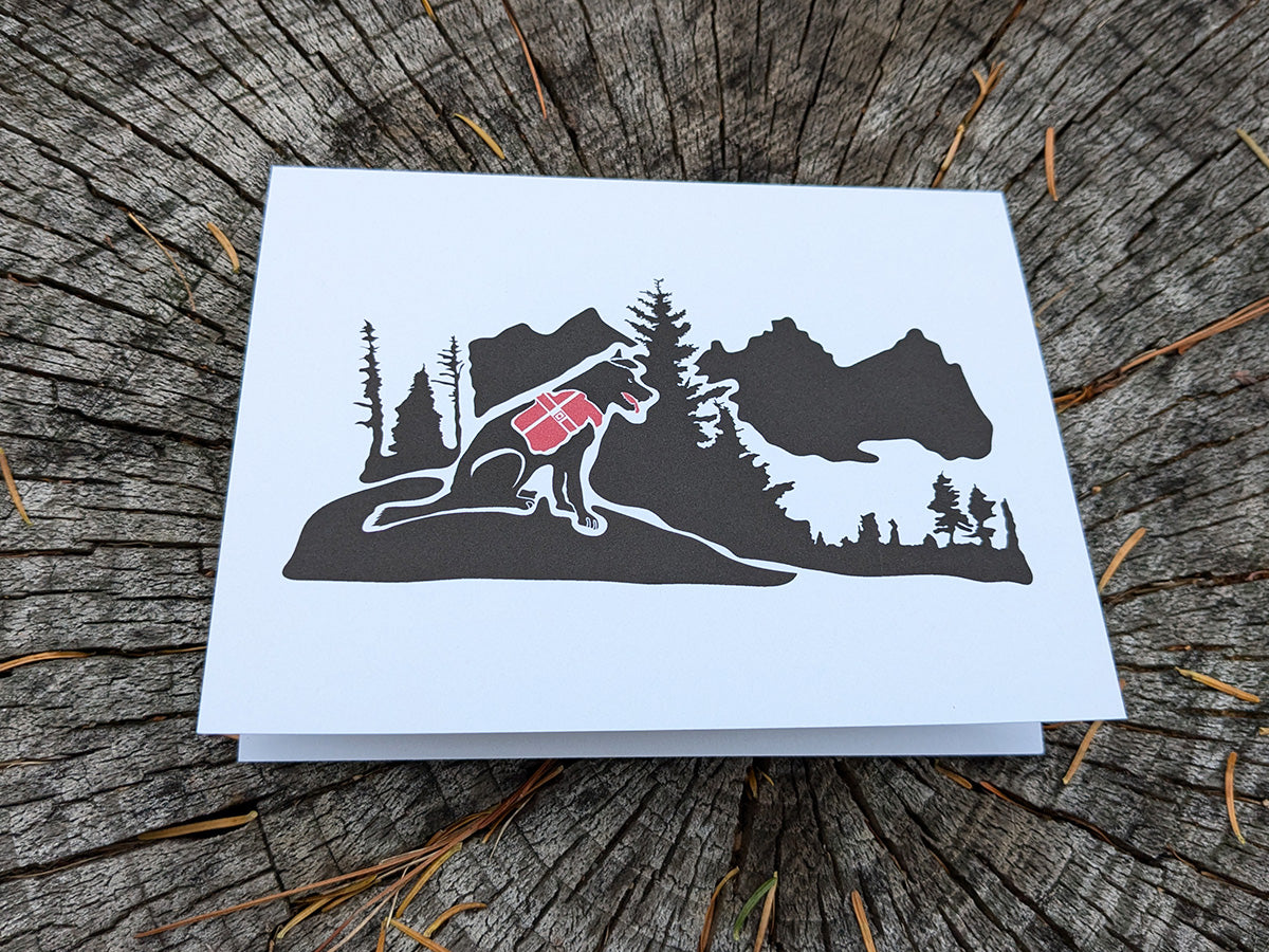 Greeting card with dog hiking in the mountains.