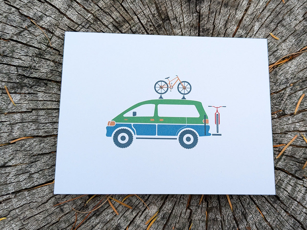 Greeting card with image of a colorful van with 2 bikes.